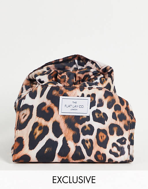 The Flat Lay Co. X ASOS Exclusive Drawstring Makeup Bag - Warped Leopard  Print | ASOS