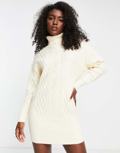 The Frolic cable knit roll neck mini jumper dress in cream