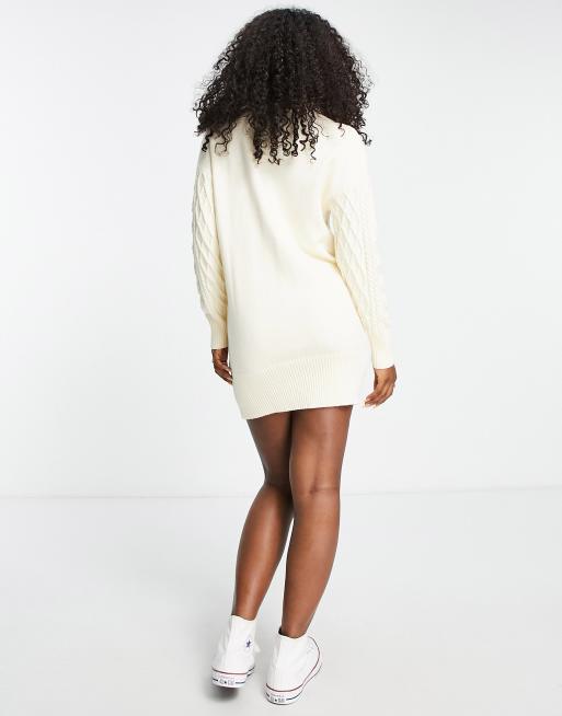 The Frolic cable knit roll neck mini jumper dress in cream