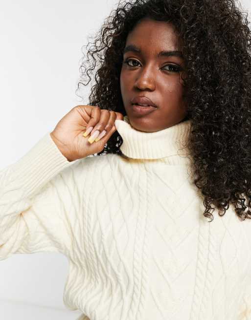 The Frolic cable knit roll neck mini jumper dress in cream