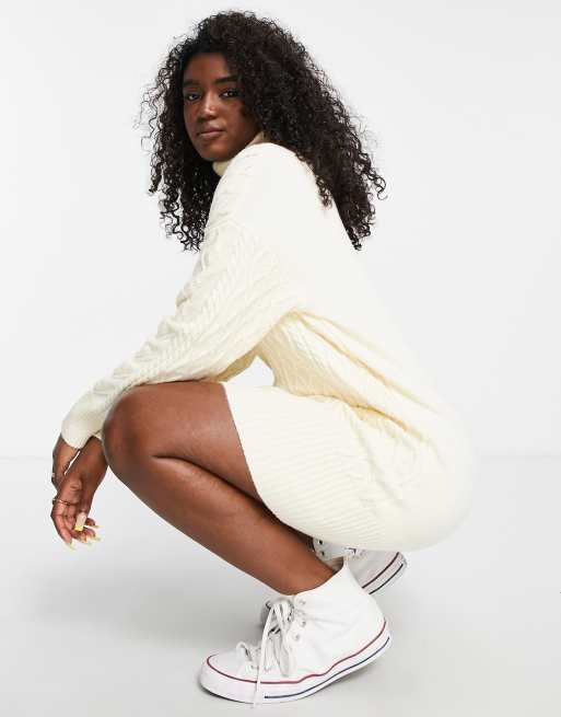 The Frolic cable knit roll neck mini jumper dress in cream ASOS