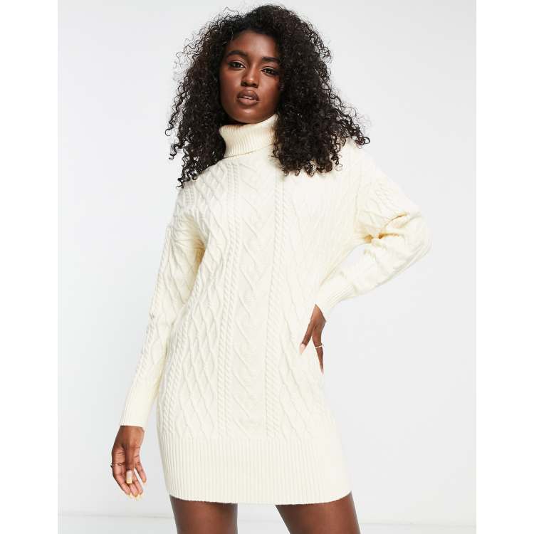 The Frolic cable knit roll neck mini sweater dress in cream