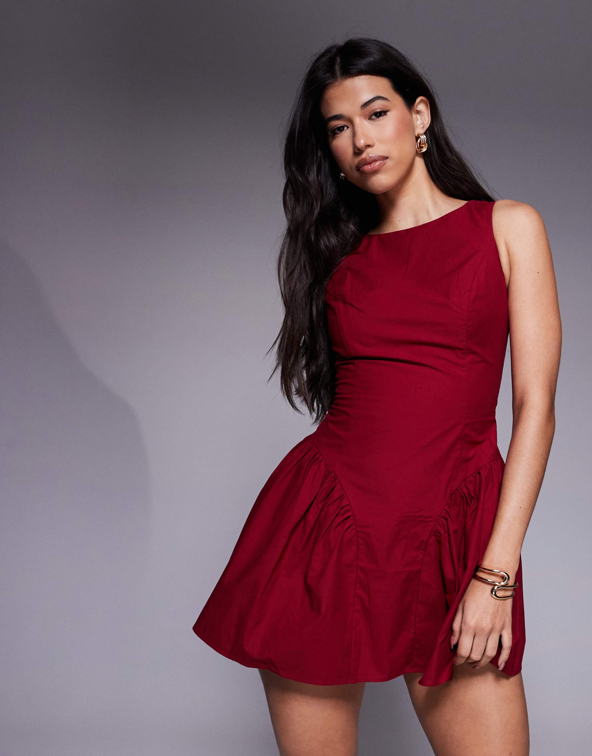 the frolic exclusive bengaline sleeveless slash neck hip pleat detail mini dress in burgundy