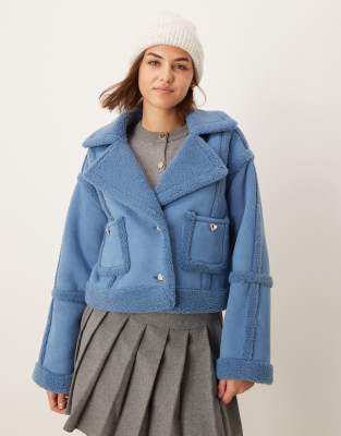 exclusive faux shearling gold heart button detail jacket in blue