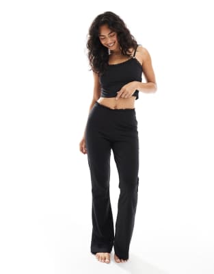 The Frolic exclusive lace trim jersey slim flare pyjama pants in black (Part of a set)