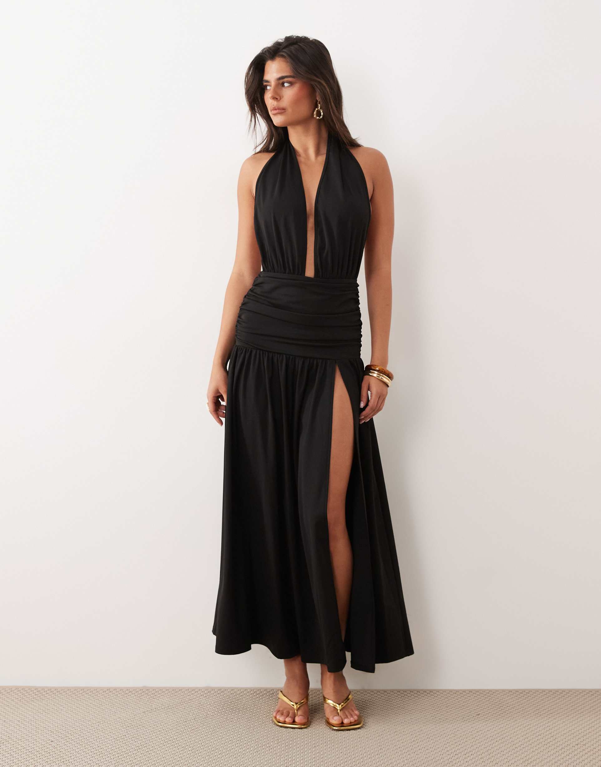 the frolic exclusive plunge halterneck shirred detail low back thigh split maxi dress in black