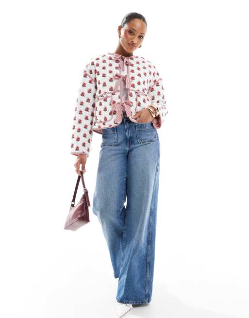The Frolic exclusive quilted bow tie front reversible jacket in cream floral and red stripe  