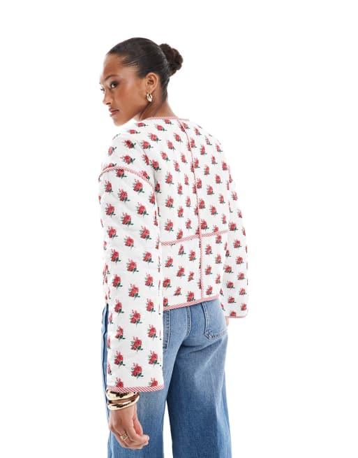 The Frolic exclusive quilted bow tie front reversible jacket in cream floral and red stripe  
