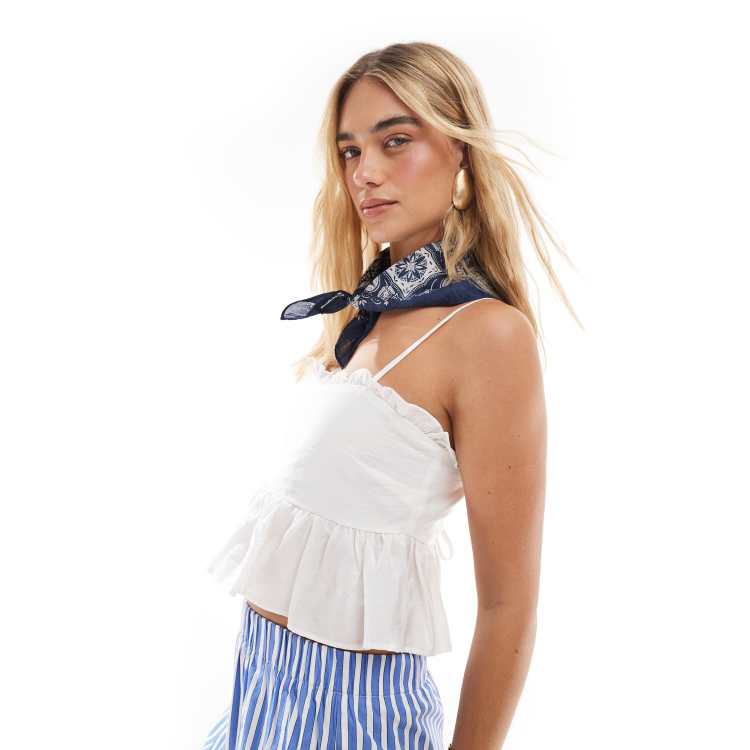 The Frolic exclusive ruffle trim tie back babydoll cami top in