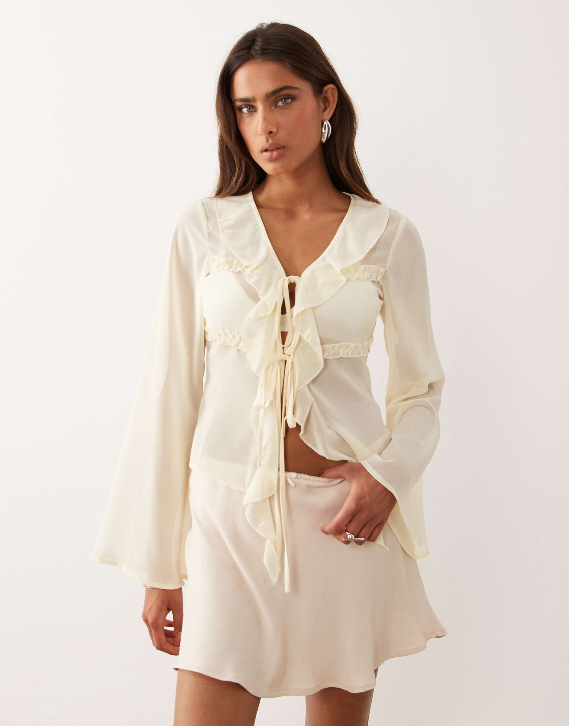 the frolic exclusive sheer chiffon frill detail tie front flare sleeve top in cream