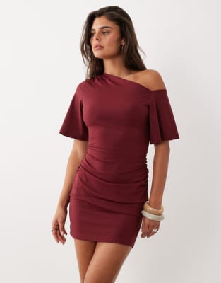 The Frolic Exclusive Slinky Asymmetric Off Shoulder Ruched Side Mini Dress In Red
