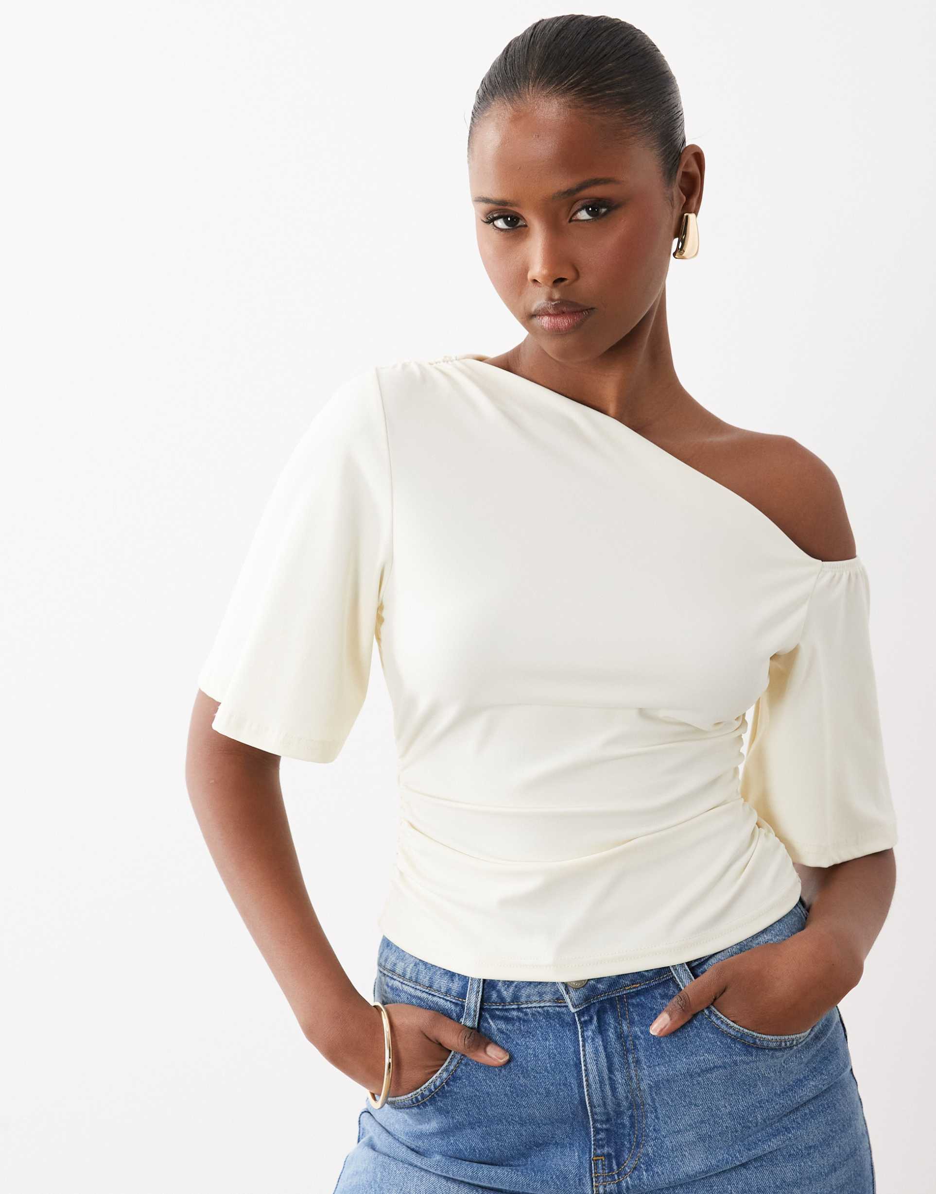 the frolic exclusive slinky draped off the shoulder top in cream