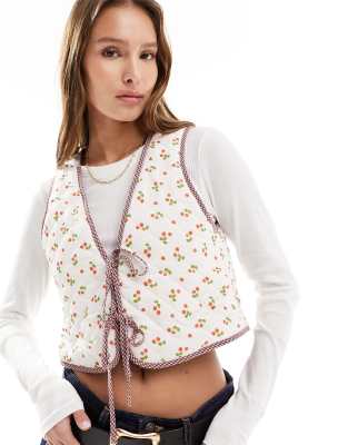 The Frolic exclusive strawberry print reversible quilted gilet in multi