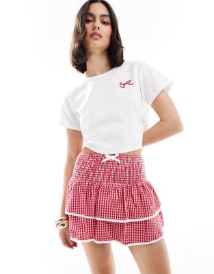 The Frolic - Exklusiv - Gestufter Rüschen-Minirock in Rot mit Vichy-Karos, Spitzenbesatz und gesmokter Taille, Kombiteil...
