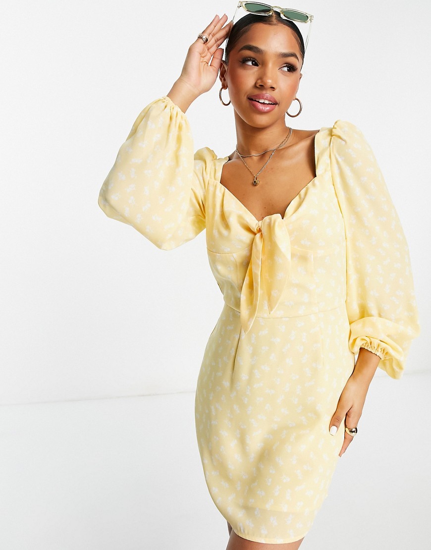 The Frolic Floral Long Sleeve Bow-front Mini Dress In Marigold-yellow