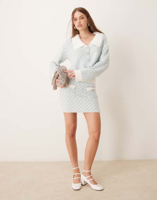 The Frolic fluffy diamante button through diamond stitch collar detail cardigan and mini skirt set in blue