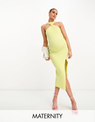 The Frolic Maternity midi dress with twist high neck and side slit in yellow