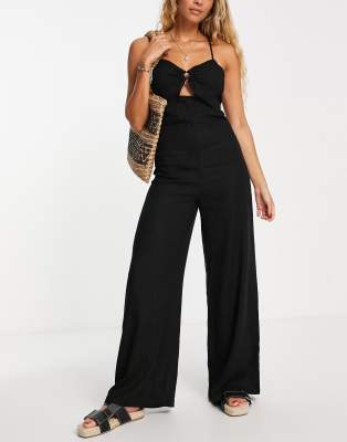 The Frolic - Meg - Jumpsuit in Schwarz mit weitem Bein