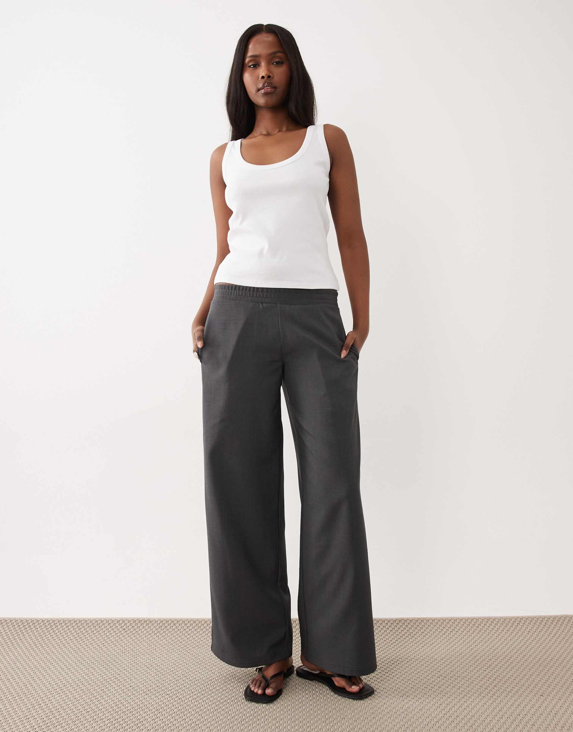the frolic mid rise elastic waist wide leg pants in charcoal