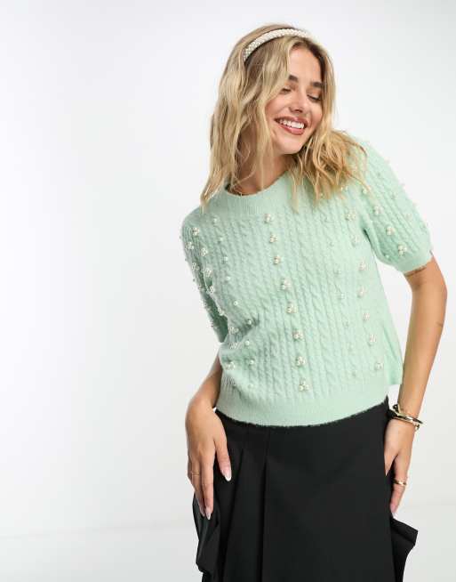 Sweater with outlet pearls on sleeves