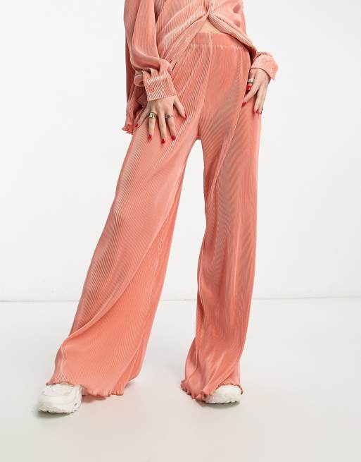 The Frolic plisse wide leg pants in cantaloupe orange - part of a set