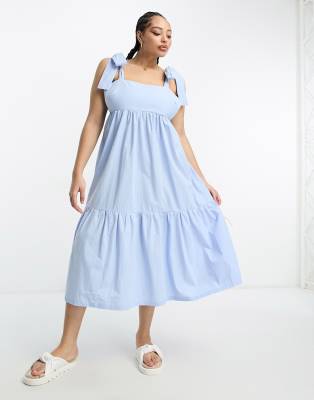 The Frolic Plus tiered midi dress with tie straps in blue poplin