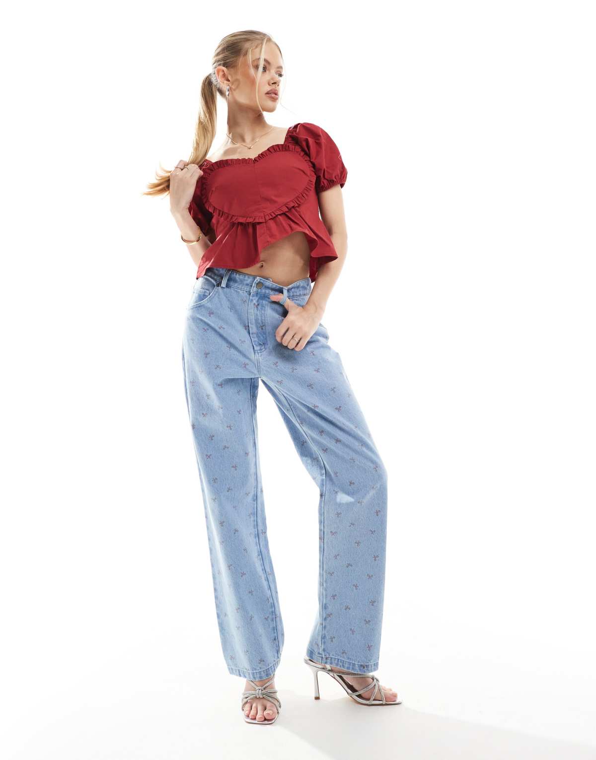 The Frolic puff sleeve heart detail peplum top and embroidered bow jeans co-ord in blue