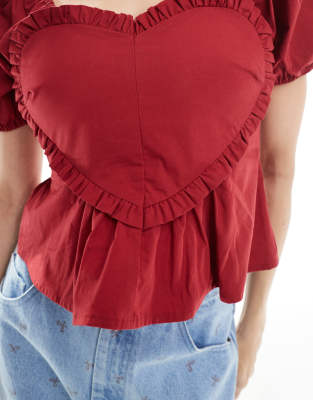 The Frolic Puff Sleeve Ruffle Heart Detail Peplum Crop Top In Red