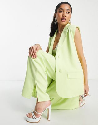 THE FROLIC SLEEVELESS TAILORED JACKET IN SOFT LIME-GREEN