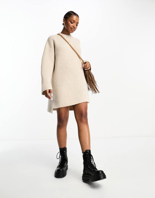 The Frolic cable knit roll neck mini jumper dress in cream