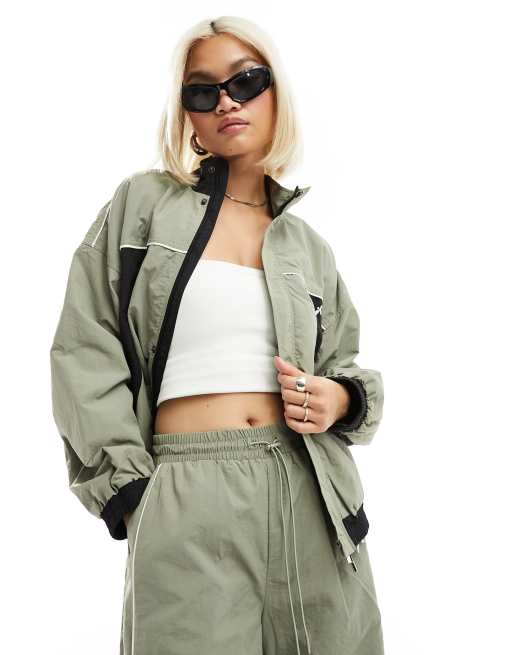The Kript contrast windbreaker jacket co-ord in sage and black