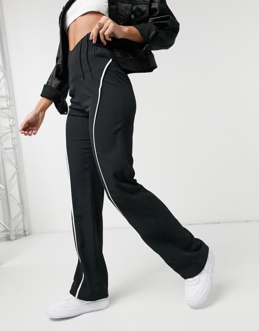 The Kript high waist corset detail flare trousers with reflective