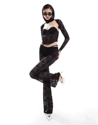 The Kript low rise flare pants in sheer lace (part of a set)