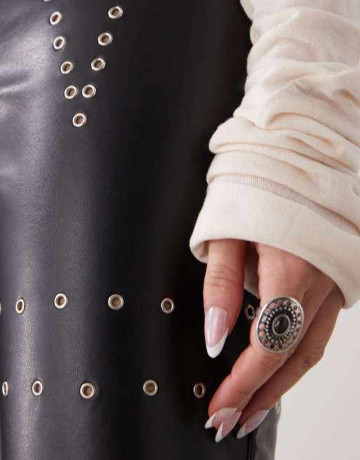 The Kript low rise leather pants with studs in black