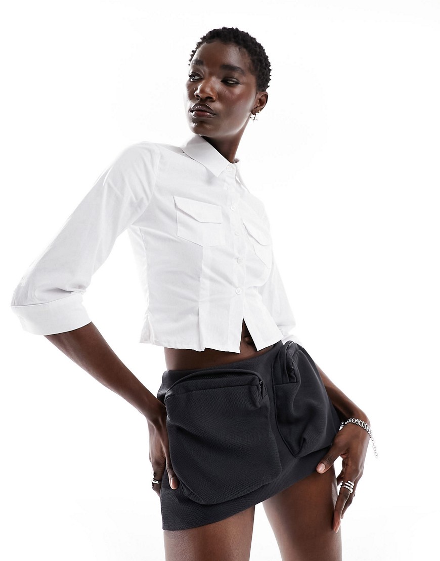 The Kript micro mini cargo skirt with oversized pockets in black