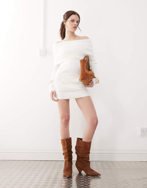 The Kript off shoulder mini dress with faux fur cuffs and fold over in white