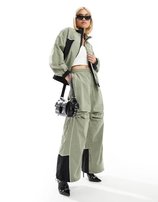 The Kript wide leg tech pants with contrast detail in sage and black (part of a set)