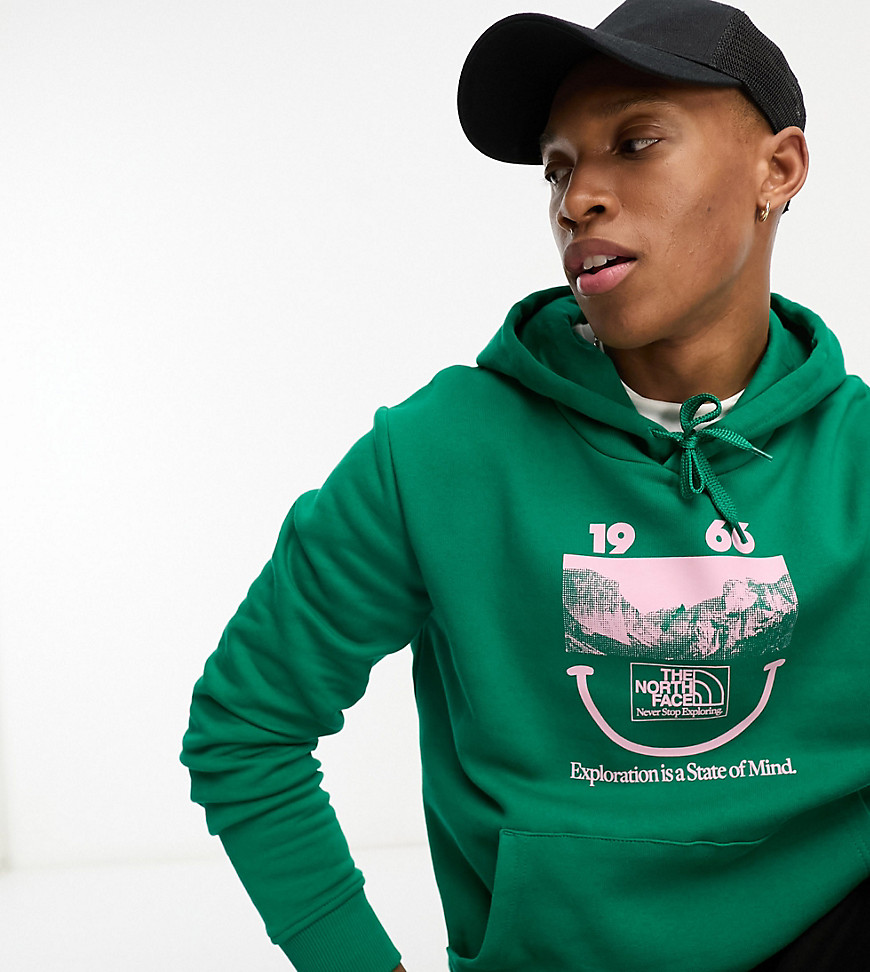 The North Face 1966 Smile Face printed oversized hoodie in green Exclusive at ASOS