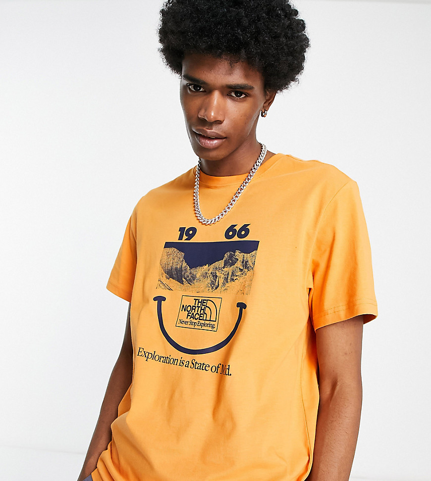The North Face 1966 Smile Face t-shirt in orange Exclusive at ASOS