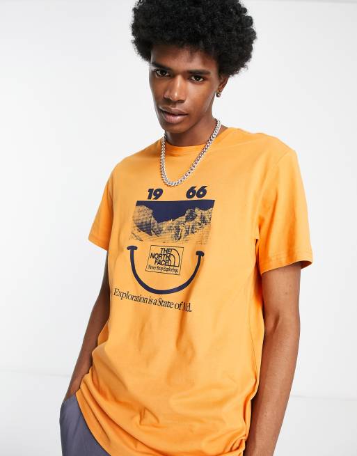 The North Face 1966 Smile Face t-shirt in orange Exclusive at ASOS | ASOS