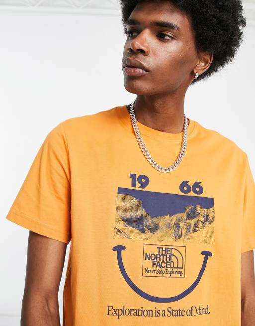 The North Face 1966 Smile Face t shirt in orange Exclusive at ASOS