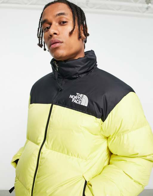 Doudoune the north face jaune et noir sale