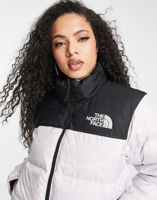 The North Face 1996 Retro Nuptse down jacket in lavender splatter print