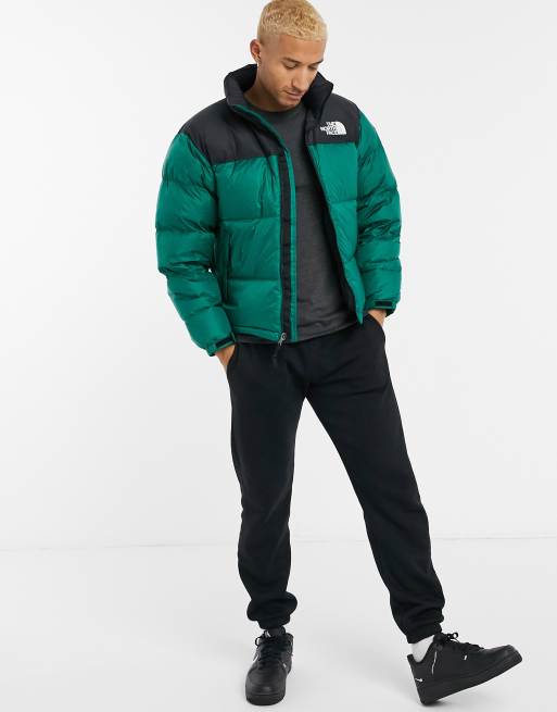 Shop The North Face 1996 Retro Nuptse Jacket NF0A3C8D-NYC green