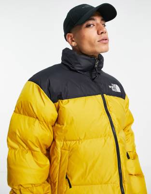 the north face 1996 retro nuptse jacket arrowwood yellow