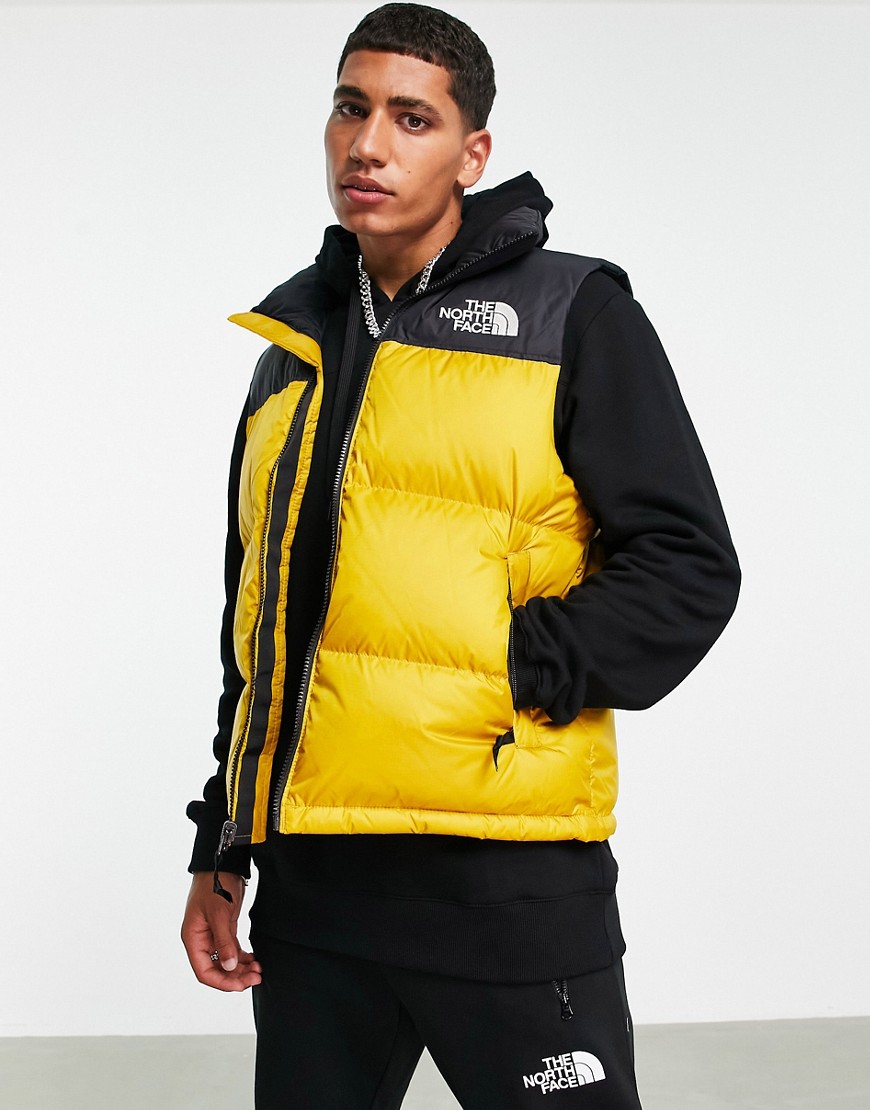 The North Face 1996 Retro Nutpse hooded tank in mustard
