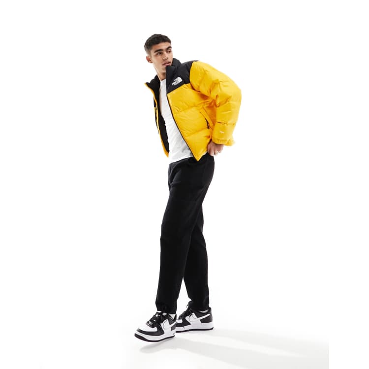 The North Face 96 Retro Nuptse down puffer jacket in yellow and black ASOS