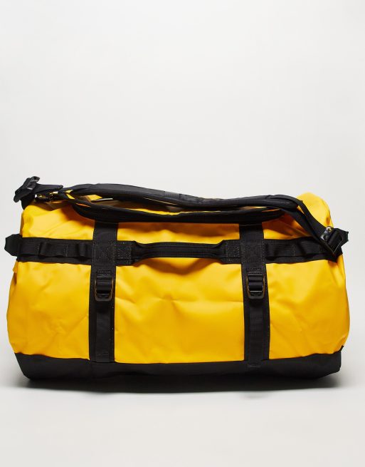 The North Face Base Camp 50l small duffel bag in yellow and black | ASOS