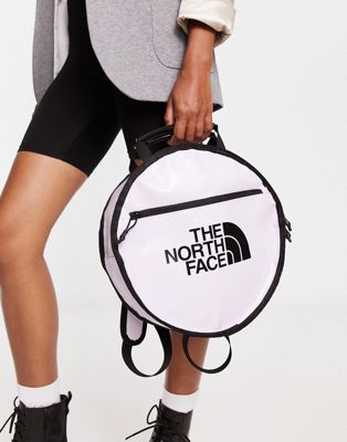 The North Face Base Camp circle bag in lilac and black