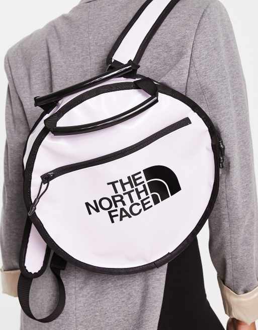 The North Face Base Camp circle bag in lilac and black | ASOS